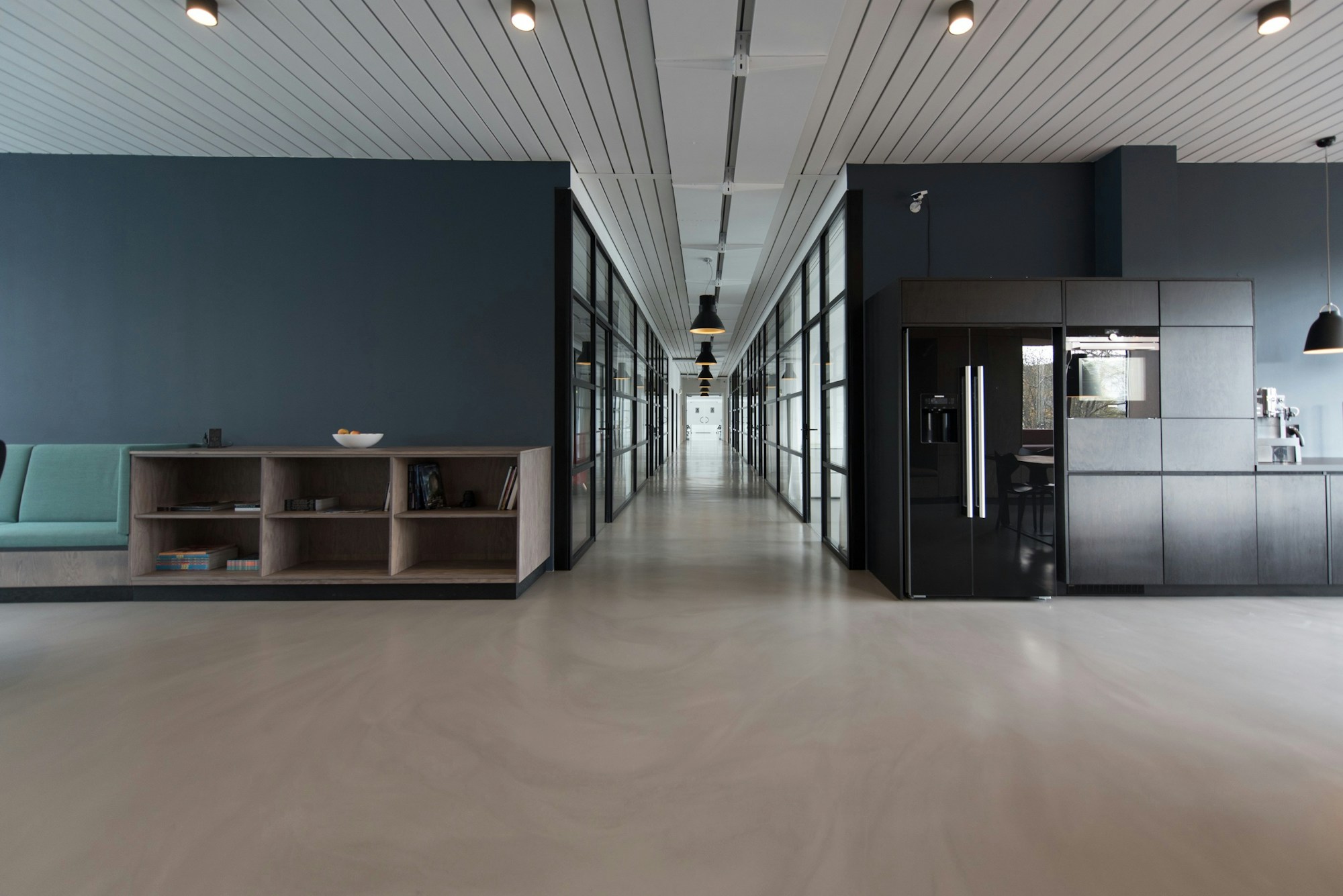 Bright open office workspace with large windows