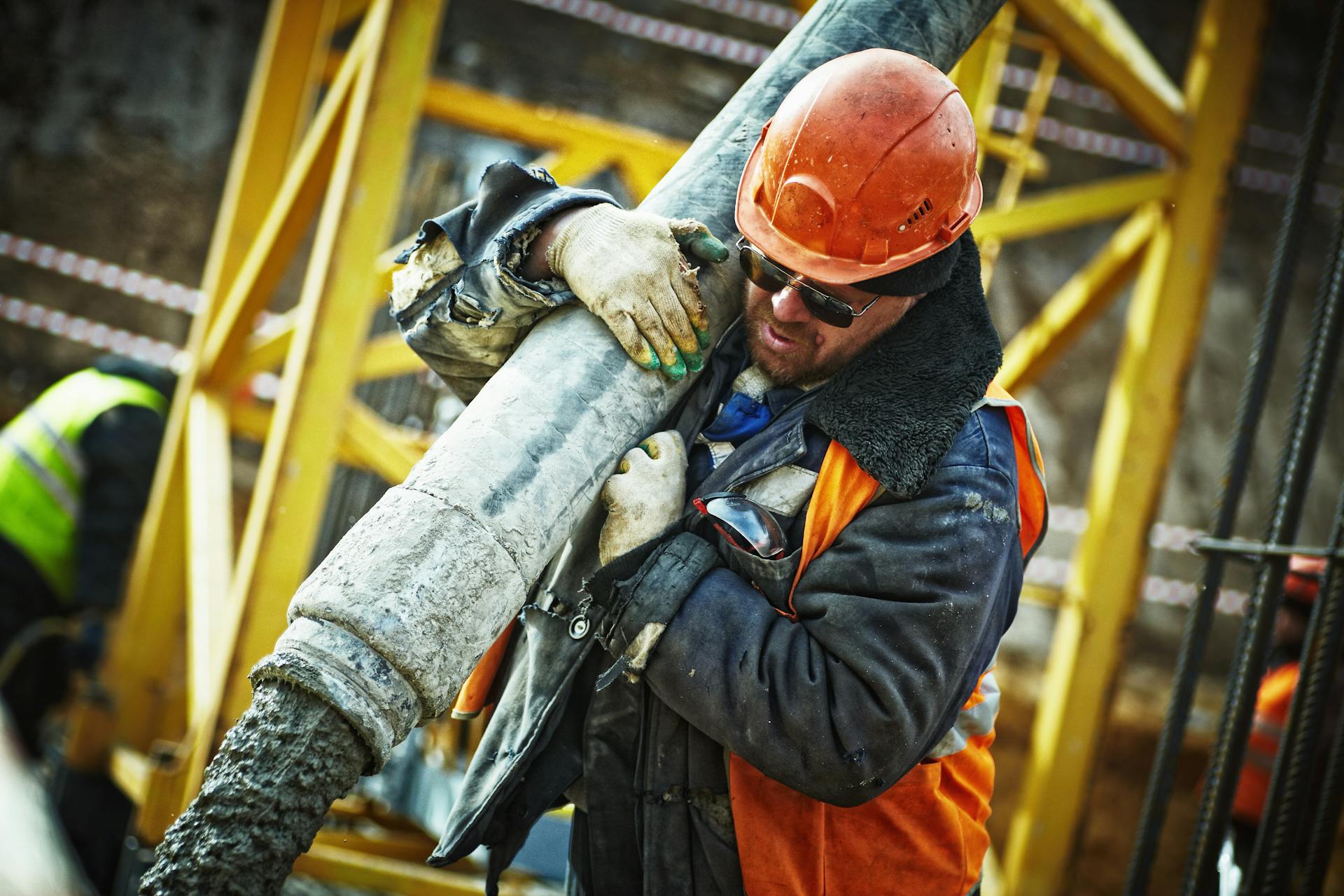 Construction workers reviewing plans on a building site